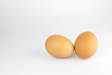 Two brown chicken egg isolated on white