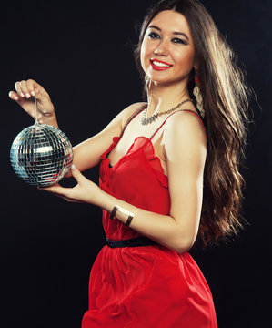 Young  Woman In Red Dress Keeping Disco Ball