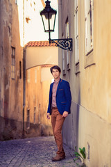 Fototapeta na wymiar portrait of young man, dressed in a blue jacket