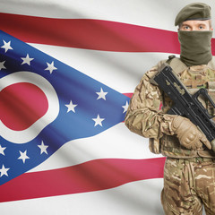 Soldier with machine gun and USA state flag on background - Ohio