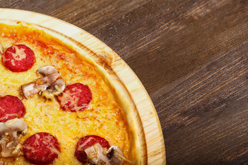 Delicious italian pizzas served on wooden table