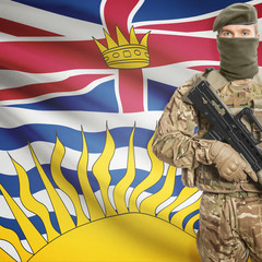 Soldier with machine gun and Canadian province flag on background series - British Columbia