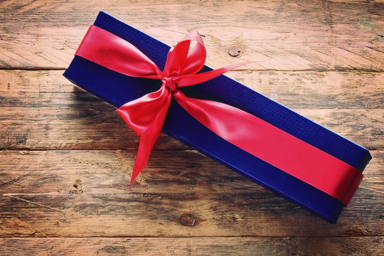 Holiday Blue Gift Box With Red Ribbon