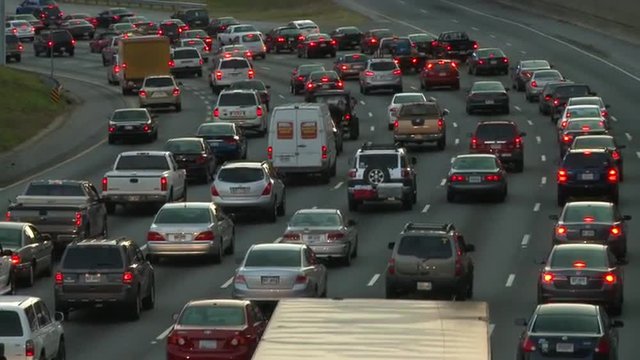 Traffic jam, heavy slow moving traffic on the freeway in a big city, Atlanta Georgia.
