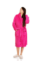 Beautiful woman in pink bathrobe.