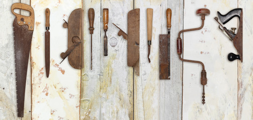 carpenter tools on wooden background