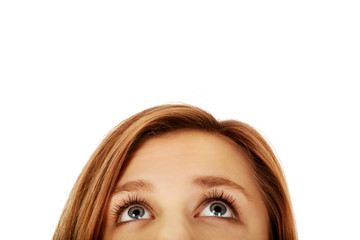 Teenage woman eyes looking up