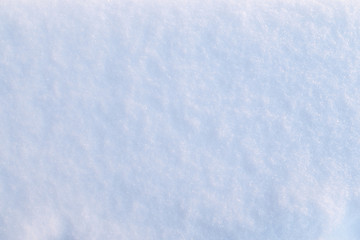 Snow at a sunny day texture background.