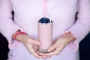 healthy eating, cooking, vegetarian food, dieting and people concept and berries preparing milk shake at home