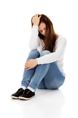 Young depression woman sitting on the floor