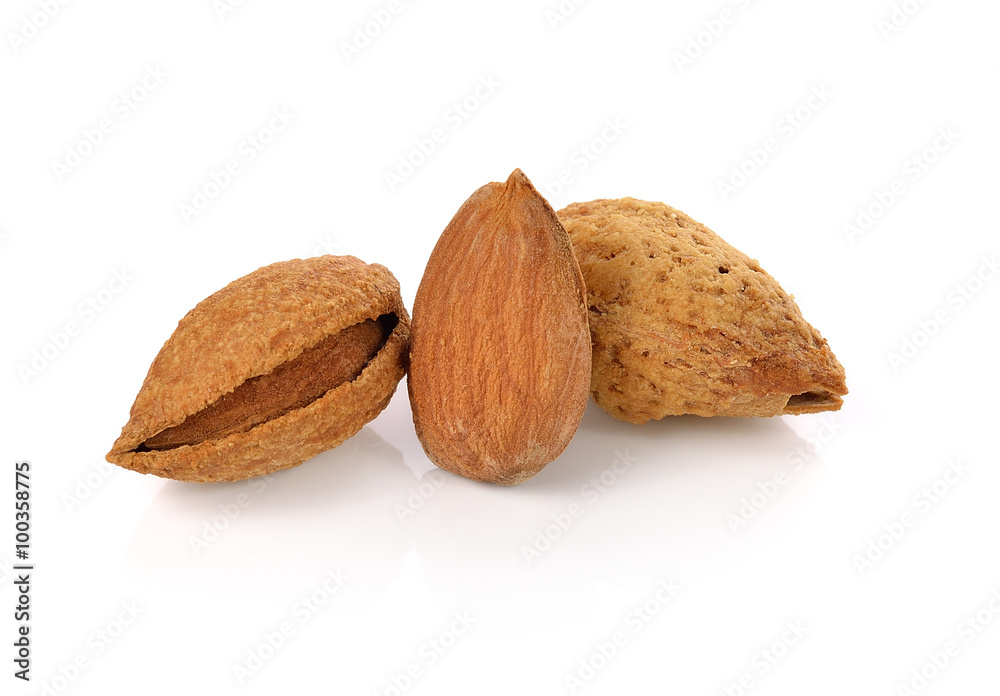 Wall mural almond nuts isolated on white background