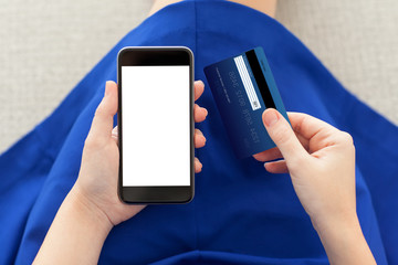 woman holding a phone with isolated screen and credit card
