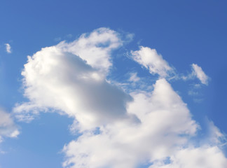 Blue sky with fluffy white clouds in day light