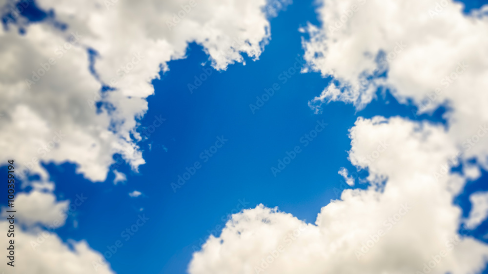 Wall mural blue window in the cloudy sky - tilt shift selective focus effect