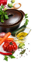 Fresh vegetables around pan