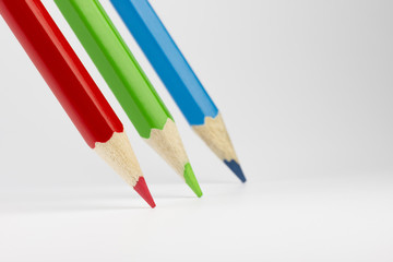 Three colored pencils in RGB colors.