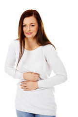 Young woman with stomach pain from laugh