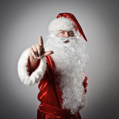 Santa Claus pushing the button