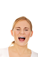 Stressed or angry young woman screaming