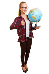 Woman as teacher holding thumb up