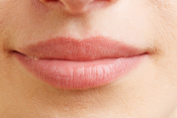 Obraz premium Close-up of closed female mouth