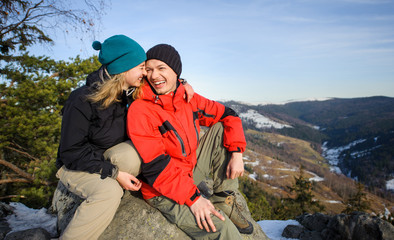 Fototapeta premium Portrait of happy hikers relaxing on top of the mountain