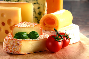 Different sorts of cheese on kitchen table