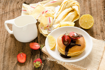 pancake decorate with strawberry and lemon