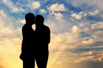 Silhouette happy gay kissing