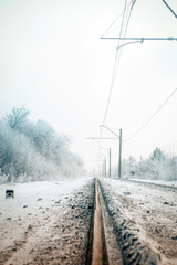Gradient colorize railway in the winter forest, view from