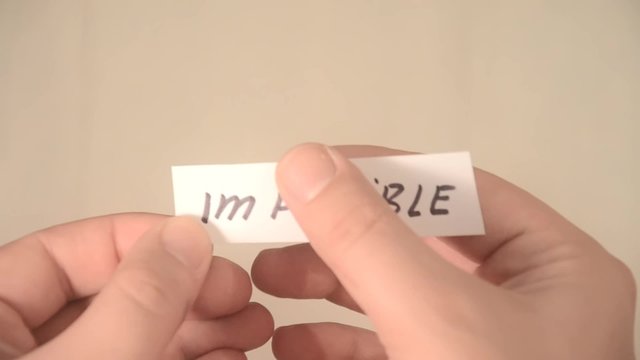 impossible turns to possible. Changing the word impossible to possible. Man makes the impossible possible