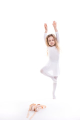Fototapeta premium Little ballerina isolated on white background.