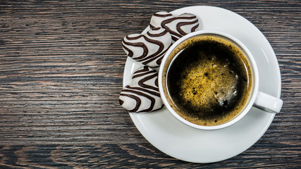 Coffee cup on wooden table.