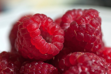 Some juicy and tasty raspberries closeup
