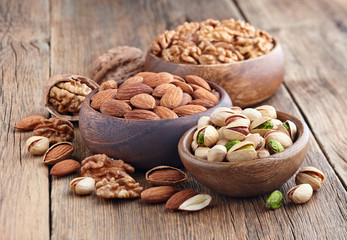 Nuts in a wooden background