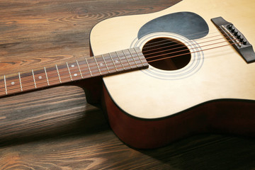 Guitar on wooden background