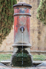 Drinking water running from an old water well in center Rome, Parco Adriano