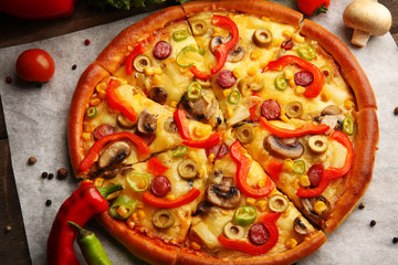 Delicious sliced pizza with vegetables, close-up