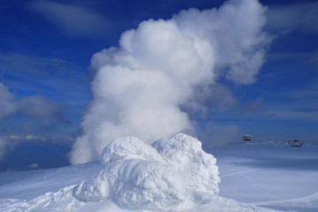 A big cloud on the snow horizon in mountain