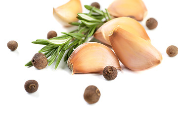 Garlic with spices isolated on white
