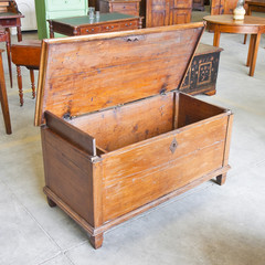 Old italian wooden renovated chest in a junk dealer shop