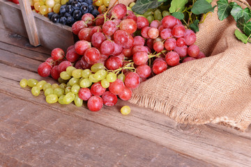 Grape in wooden box on a table