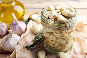 Garlic with spices on wooden table