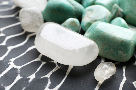 Beautiful mineral stones on dark surface