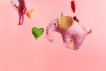 Fleece elephants on pink background
