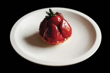 Fresh strawberry cake on the white plate