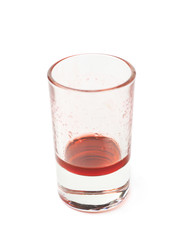 Glass shot with grenadine leftovers