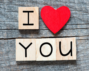 Wooden letters spelling I love you with red heart