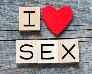 Wooden letters spelling I love SEX with heart