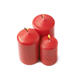 Obraz na płótnie Canvas Three burning red candles isolated